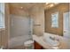 Bathroom with tiled shower-tub and updated vanity sink at 3873 Fairbrook Pt, Highlands Ranch, CO 80130