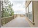 Expansive deck, complemented by stone pillars and decorative railings at 3873 Fairbrook Pt, Highlands Ranch, CO 80130