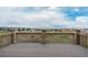 Spacious wooden deck with scenic views of the surrounding neighborhood at 3873 Fairbrook Pt, Highlands Ranch, CO 80130
