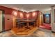 Unique dining space features a custom elevated dining booth and dramatic lighting at 3873 Fairbrook Pt, Highlands Ranch, CO 80130
