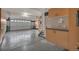 Spacious garage with epoxy floors, storage cabinets, and an automated door at 3873 Fairbrook Pt, Highlands Ranch, CO 80130