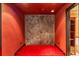 Striking hallway leads to bathroom with ornate metal double doors and red carpet at 3873 Fairbrook Pt, Highlands Ranch, CO 80130
