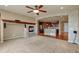 Spacious living area with fireplace, hardwood flooring, and open access to the kitchen at 3873 Fairbrook Pt, Highlands Ranch, CO 80130