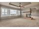 Expansive living room featuring a fireplace, ceiling fan, and neighborhood views at 3873 Fairbrook Pt, Highlands Ranch, CO 80130