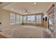 Cozy living room featuring a fireplace, plush carpet, and natural light at 3873 Fairbrook Pt, Highlands Ranch, CO 80130