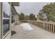 Spacious back deck offering outdoor seating and views of the surrounding trees at 17423 Cornerstone Ln, Parker, CO 80134
