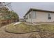 Backyard with a well-maintained lawn, landscaping, and a wooden fence at 17423 Cornerstone Ln, Parker, CO 80134