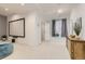 Finished basement area with a media screen, storage cabinet, and comfortable seating at 17423 Cornerstone Ln, Parker, CO 80134