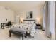 Bedroom with carpet, large bed, window, and desk at 17423 Cornerstone Ln, Parker, CO 80134