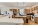 Bright and functional kitchen featuring wooden cabinets, modern appliances, and a center island at 17423 Cornerstone Ln, Parker, CO 80134
