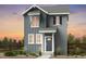 Charming two-story home features vertical siding, white trim, and a welcoming front entrance at 6601 E 148Th Dr, Thornton, CO 80602