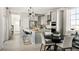 Open floor plan featuring the kitchen with a center island and an adjacent dining area at 6601 E 148Th Dr, Thornton, CO 80602