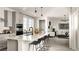 Open-concept kitchen and living area with a view of modern appliances and neutral decor at 6601 E 148Th Dr, Thornton, CO 80602