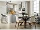 Contemporary kitchen with an island and dining area perfect for gatherings at 6601 E 148Th Dr, Thornton, CO 80602