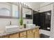This bathroom offers double sinks, granite countertops, and a shower and tub combo at 22932 E Ontario Dr # 102, Aurora, CO 80016