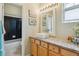 Stylish bathroom with a modern vanity, vessel sink, and sleek shower showcasing contemporary design at 22932 E Ontario Dr # 102, Aurora, CO 80016