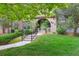 Charming brick home with an arched entryway, landscaped lawn, and inviting curb appeal at 22932 E Ontario Dr # 102, Aurora, CO 80016