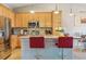 This kitchen boasts stainless steel appliances, granite countertops, and a breakfast bar with seating at 22932 E Ontario Dr # 102, Aurora, CO 80016