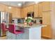Modern kitchen featuring granite countertops, stainless steel appliances, and a breakfast bar with seating at 22932 E Ontario Dr # 102, Aurora, CO 80016