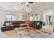 Spacious living room featuring a comfortable sectional sofa, high ceilings, and abundant natural light at 22932 E Ontario Dr # 102, Aurora, CO 80016