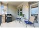 Outdoor patio space with grill, seating and covered porch, perfect for entertaining at 22932 E Ontario Dr # 102, Aurora, CO 80016