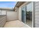 Private patio area with sliding glass door and outdoor space at 22932 E Ontario Dr # 102, Aurora, CO 80016