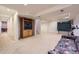 Finished basement featuring carpet floors, a TV cabinet, and a ping pong table, with stairs to the upper level at 8807 Tuscany Ln, Highlands Ranch, CO 80130