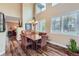 Elegant dining room with a chandelier, hardwood floors, and plenty of natural light at 8807 Tuscany Ln, Highlands Ranch, CO 80130