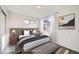 Main bedroom with a plush bed and ample natural light at 10291 E 62Nd Pl, Denver, CO 80238