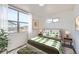 Bedroom with a queen bed and large windows at 10291 E 62Nd Pl, Denver, CO 80238