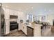 Modern kitchen featuring stainless steel appliances and white cabinetry at 10291 E 62Nd Pl, Denver, CO 80238