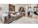 Open-concept living room and kitchen featuring modern decor and appliances at 19118 E 54Th Pl, Denver, CO 80249