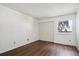 Bright bedroom with hardwood floors and double door closet at 13609 E Yale Ave # A, Aurora, CO 80014