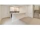 Basement bar features white cabinetry, modern hardware, and wine fridge at 11454 Stonewash St, Littleton, CO 80125