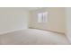 Spacious basement with neutral carpet, egress window, and ample natural light at 11454 Stonewash St, Littleton, CO 80125
