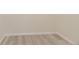 This versatile empty room boasts neutral walls and wood-look floors, ready for customization at 11454 Stonewash St, Littleton, CO 80125