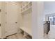 Convenient entryway with bench, coat hooks, and storage cubbies, perfect for organizing daily essentials at 11454 Stonewash St, Littleton, CO 80125