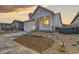 Beautiful front yard with minimal xeriscaping and a charming white exterior at 11454 Stonewash St, Littleton, CO 80125