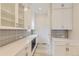 Modern white kitchen featuring sleek countertops, custom cabinets, and stylish backsplash at 11454 Stonewash St, Littleton, CO 80125