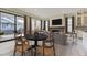 Open-concept living room with hardwood floors, fireplace, and adjacent dining area at 11454 Stonewash St, Littleton, CO 80125