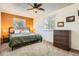 The bedroom features soft carpet and an updated ceiling fan plus two windows for ample light at 2210 S Oakland Way, Aurora, CO 80014
