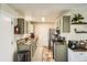 Functional kitchen offers plenty of counter space, updated appliances, and practical storage solutions, designed for culinary efficiency at 2210 S Oakland Way, Aurora, CO 80014