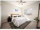 Cozy bedroom with natural light, a comfortable bed, and neutral decor at 3802 Newton, Denver, CO 80211