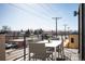 Outdoor patio with a table, chairs, and city views at 3802 Newton, Denver, CO 80211