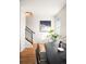 Bright dining area with staircase and black metal railings adjacent at 3802 Newton, Denver, CO 80211