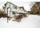 Winter backyard view, showing home, patio, and basketball hoop at 18360 E Ithaca Pl, Aurora, CO 80013