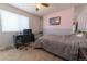 Bright bedroom with a desk, window, and a bed at 18360 E Ithaca Pl, Aurora, CO 80013