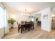 Bright dining room featuring a wood table and hardwood floors at 18360 E Ithaca Pl, Aurora, CO 80013