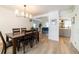 Bright dining room featuring a wood table and hardwood floors at 18360 E Ithaca Pl, Aurora, CO 80013