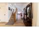 Light-filled entryway with hardwood floors and staircase at 18360 E Ithaca Pl, Aurora, CO 80013